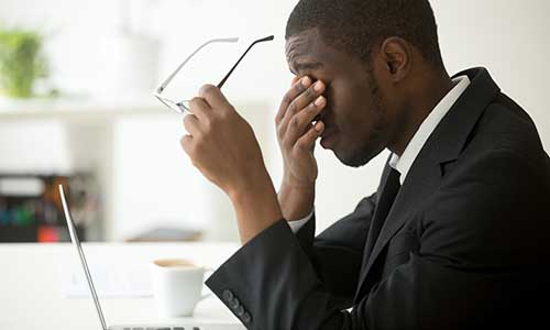 Man stressed in the workplace