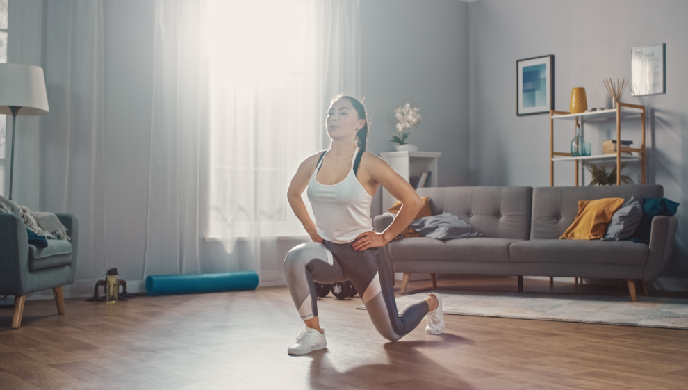 A woman performing circuit training exercises at home 