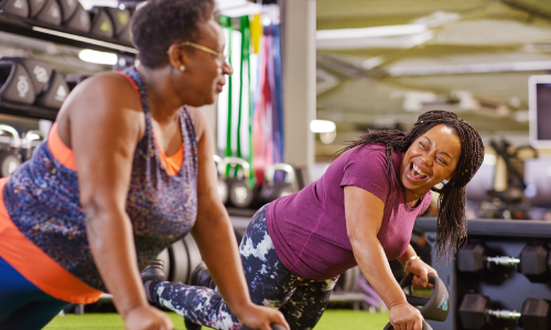 Two women performing a joint workout together