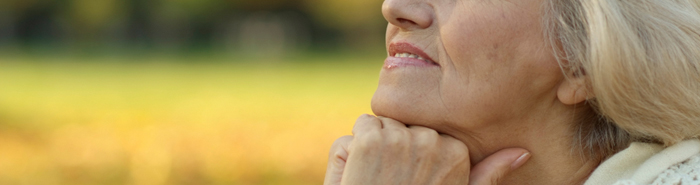 Woman with hands on her chin