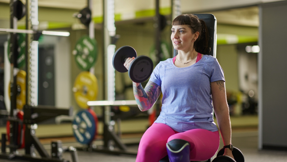 A woman lifting weights in the gym