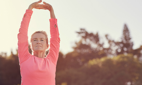 Gentle exercise done by a woman in a pink top