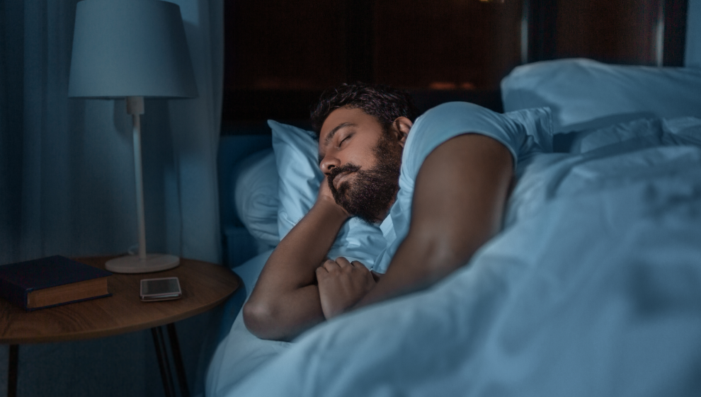 A man lays in a deep sleep