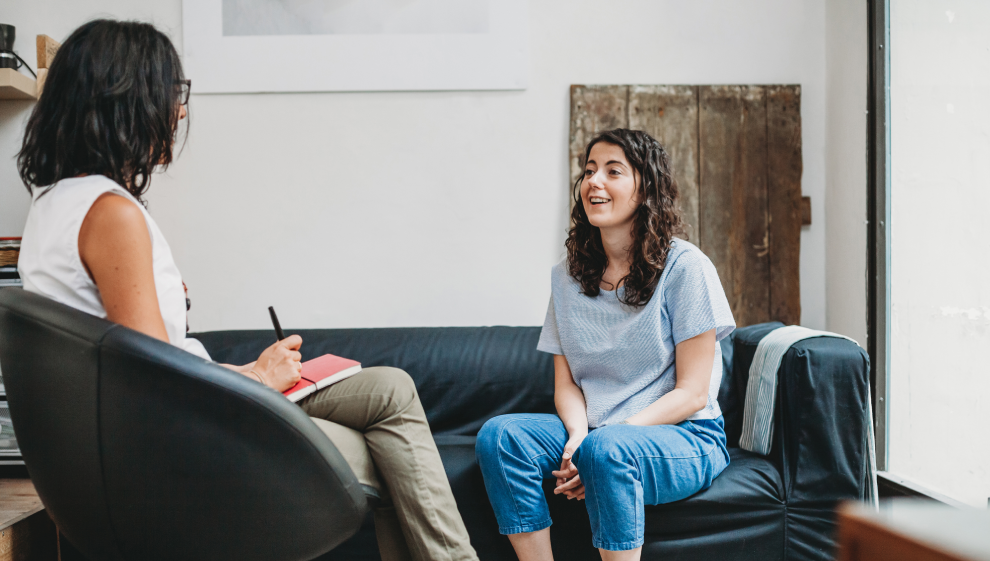 A woman discusses her mental health during a counselling session with her therapist