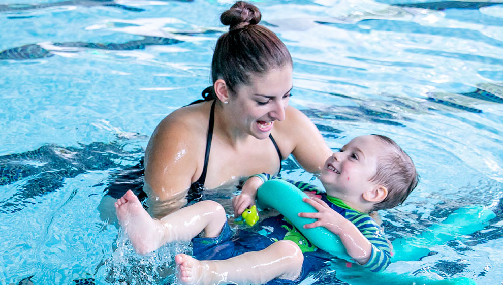 Woman and child in swimming pool