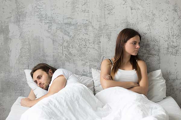 Tension between couple in bed