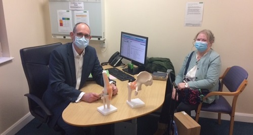 Patient Carol pictured with some of her joint model donation with Consultant Orthopaedic Surgeon Mr Mark Emerton 