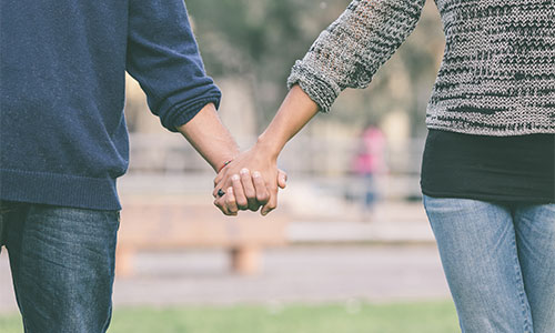 Couple holding hands