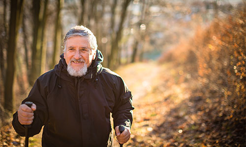 Senior man walking outdoors