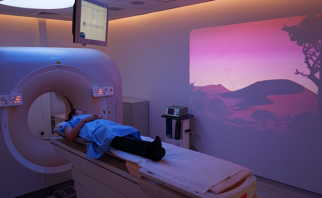 Patient in CT scan with ambient technology