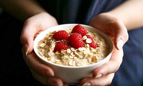 Woman holding oats