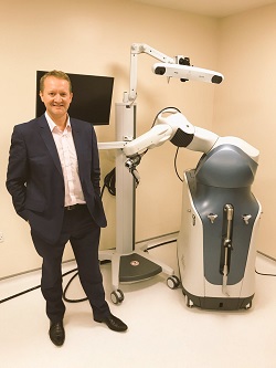 Consultant orthopaedic surgeon Mr Jon Conroy with Mako robotic-assisted surgery system