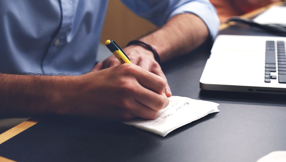 A man writing in a journal