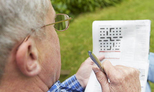 Man with crossword puzzle