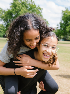 two girls playing in a park