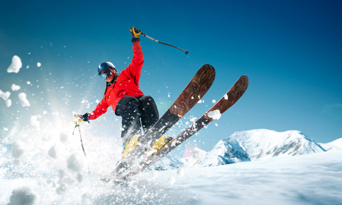 Skier falling down slope