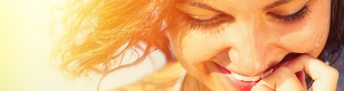 Woman smiling and looking down