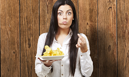 Woman eating junk food