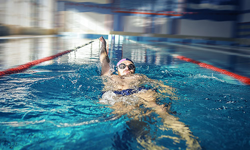 Man swimming backstroke